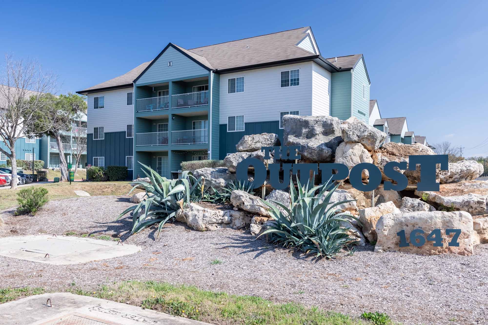 the outpost san marcos apartments near texas state university building exterior