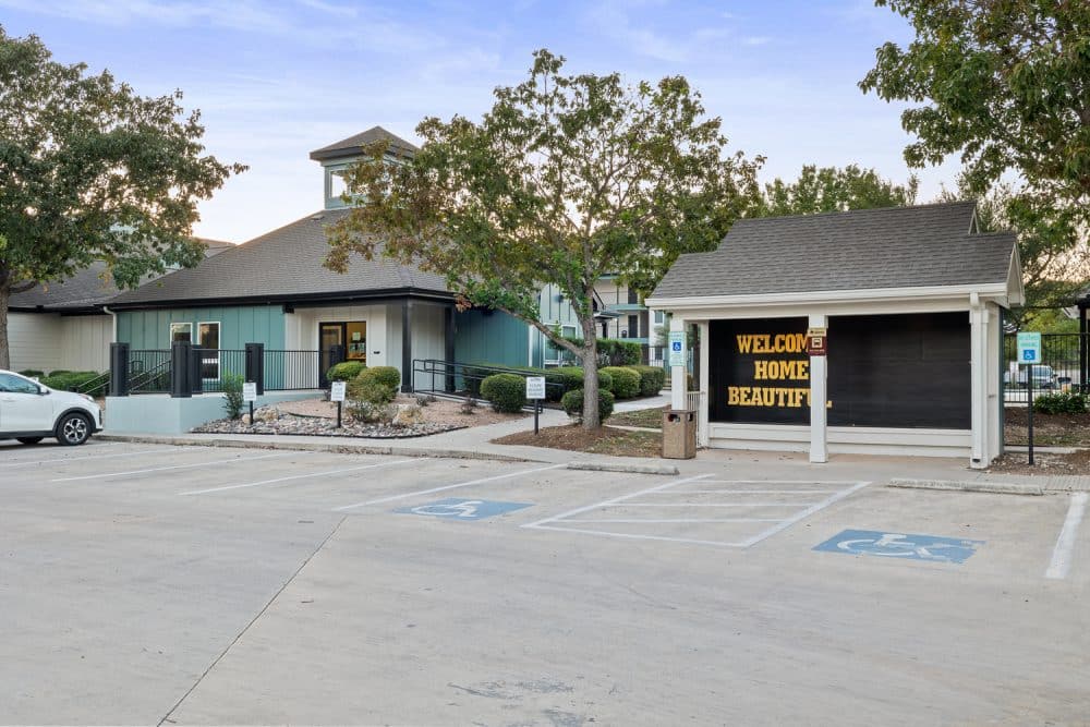 the outpost san marcos apartments near texas state university campus shuttle stop clubhouse exterior