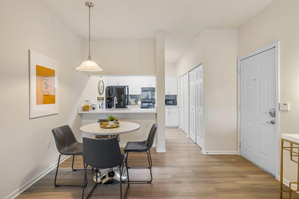 the outpost san marcos apartments near texas state university dining area and kitchen faux wood flooring